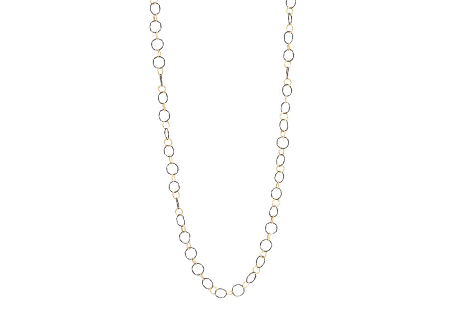 Gold chain necklace on a white background