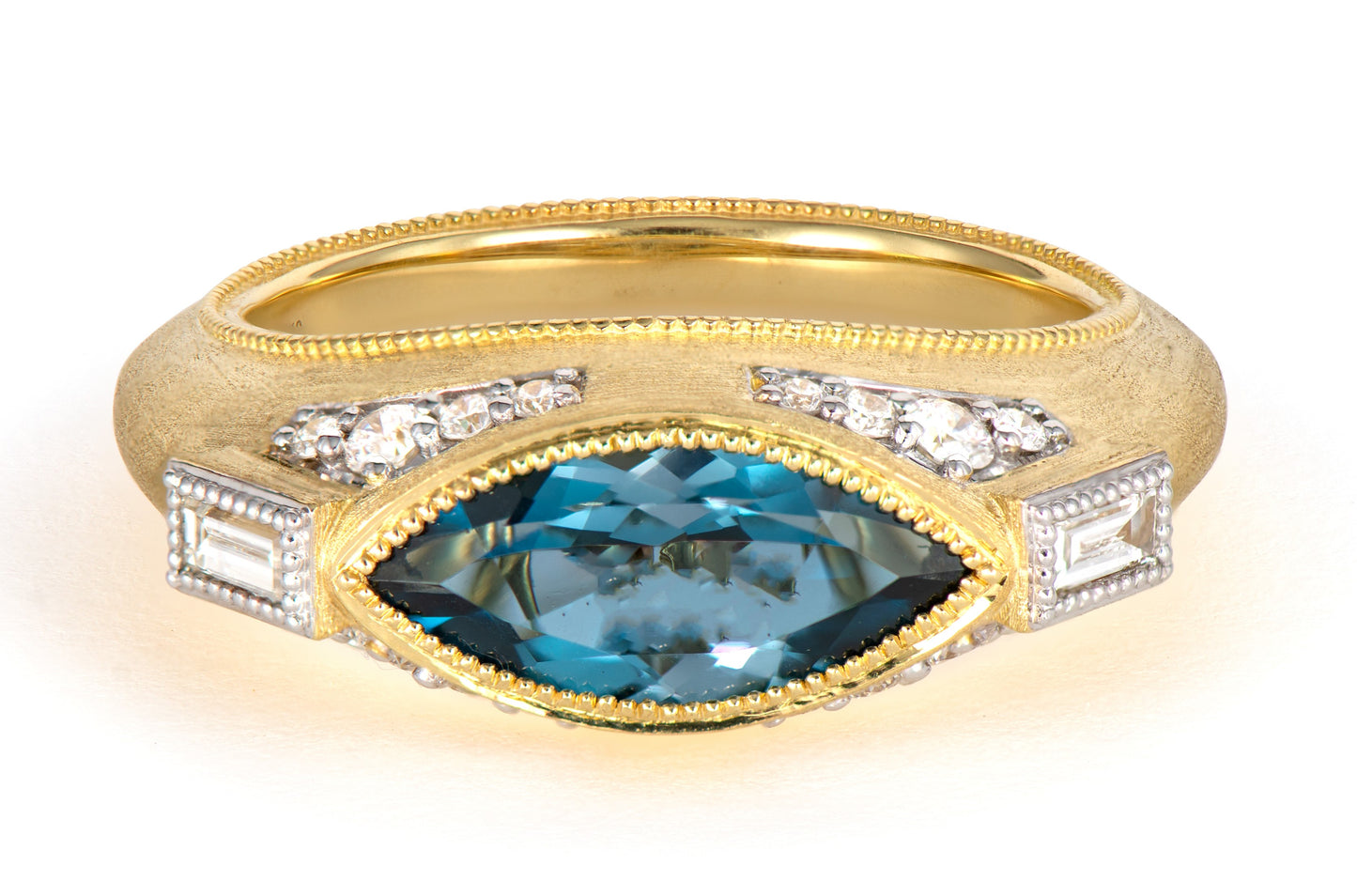 gold ring with blue topaz