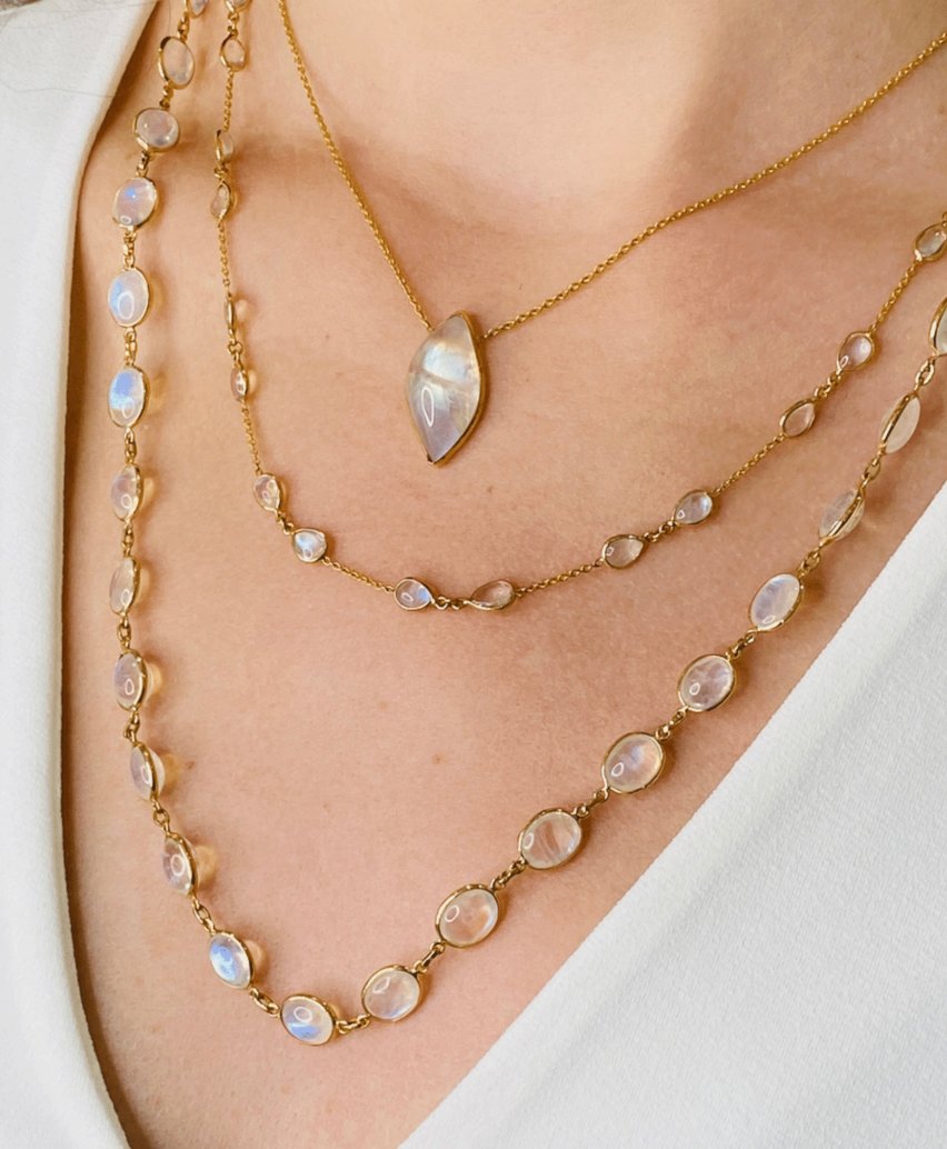 necklaces layered on her neck