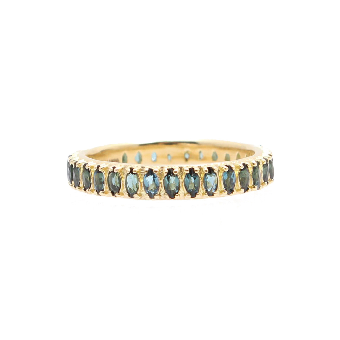 gold ring with blue green colored gemstones