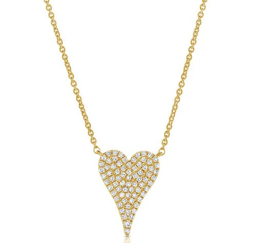 Gold necklace with a heart-shaped pendant on a white background