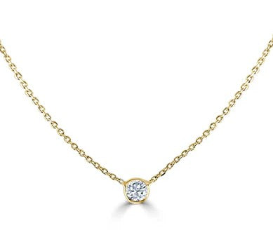 Gold necklace with a diamond pendant on a white background