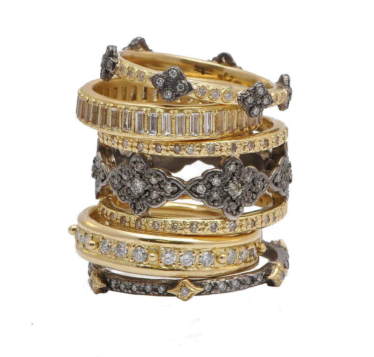gold, diamond, and gemstone rings in stack