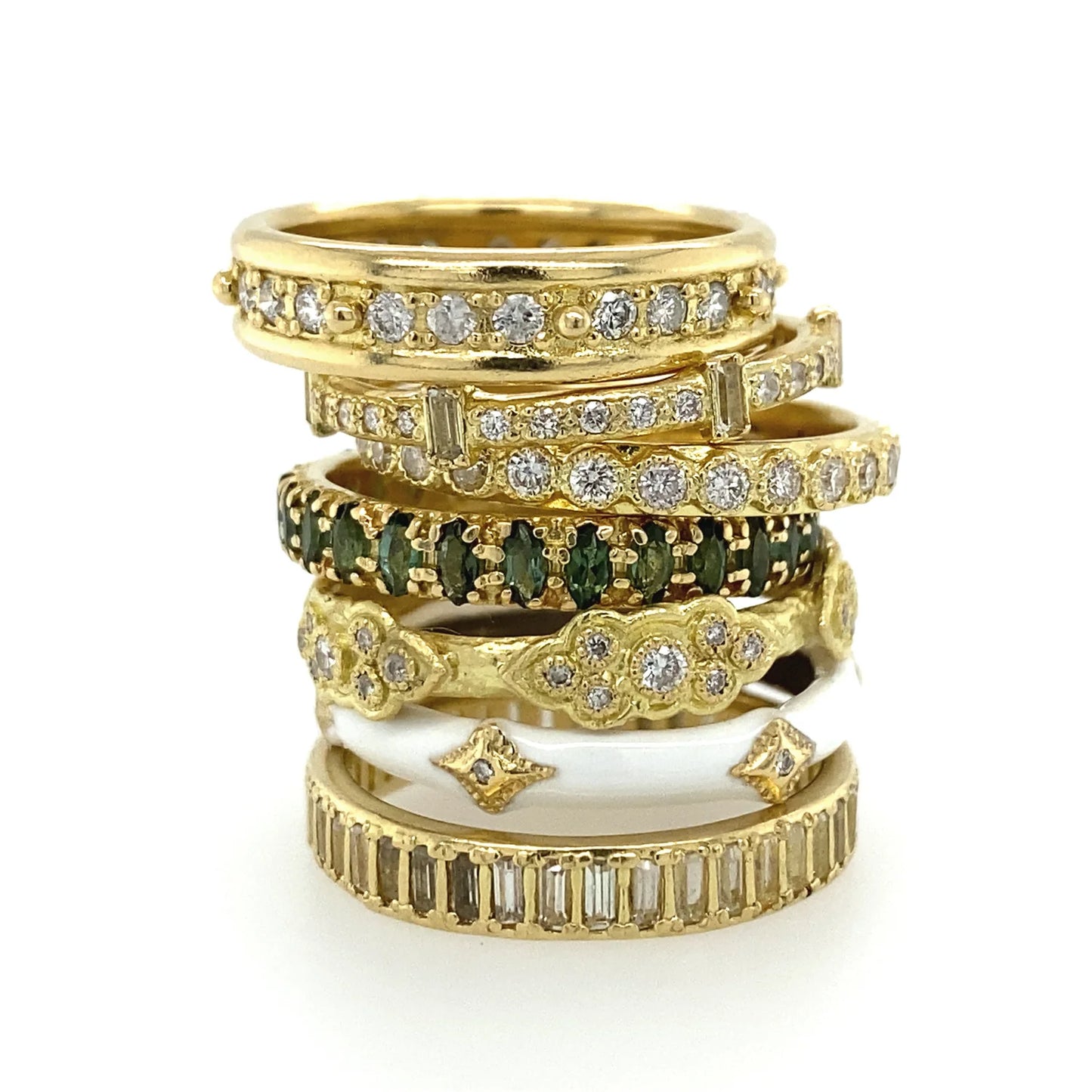 stack of multiple gold and diamond rings