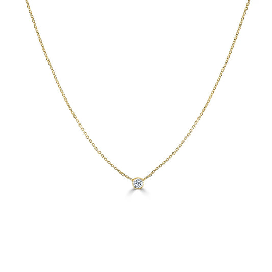 gold necklace with a bezel diamond