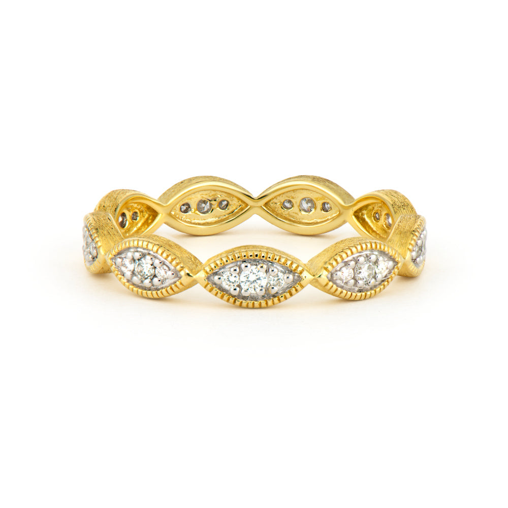 gold ring with a unique shape filled with diamonds